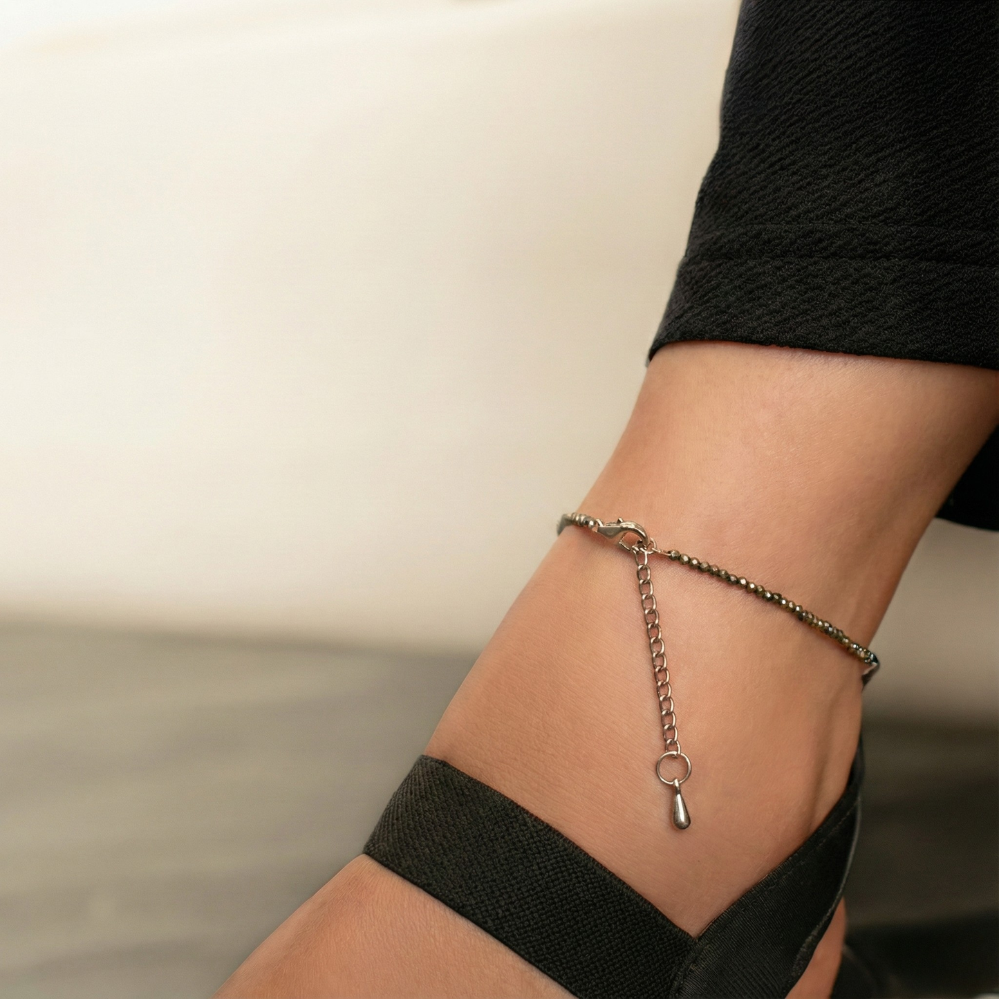 A pair of natural golden Pyrite beaded anklets designed for wealth manifestation and spiritual grounding