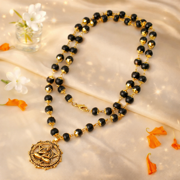 Handcrafted Gold-Plated Karungali Mala featuring natural black ebony wood beads and a detailed Lord Hanuman Kavach pendant.