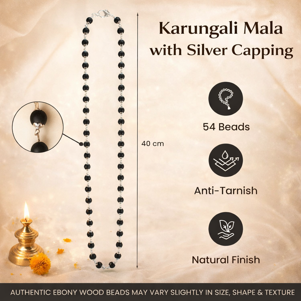 A premium Karungali Mala featuring 108 authentic black ebony wood beads, each meticulously capped with polished pure silver. The dark, matte texture of the wood contrasts beautifully with the gleaming silver caps, finished with a silver-capped Guru bead and a traditional black tassel.