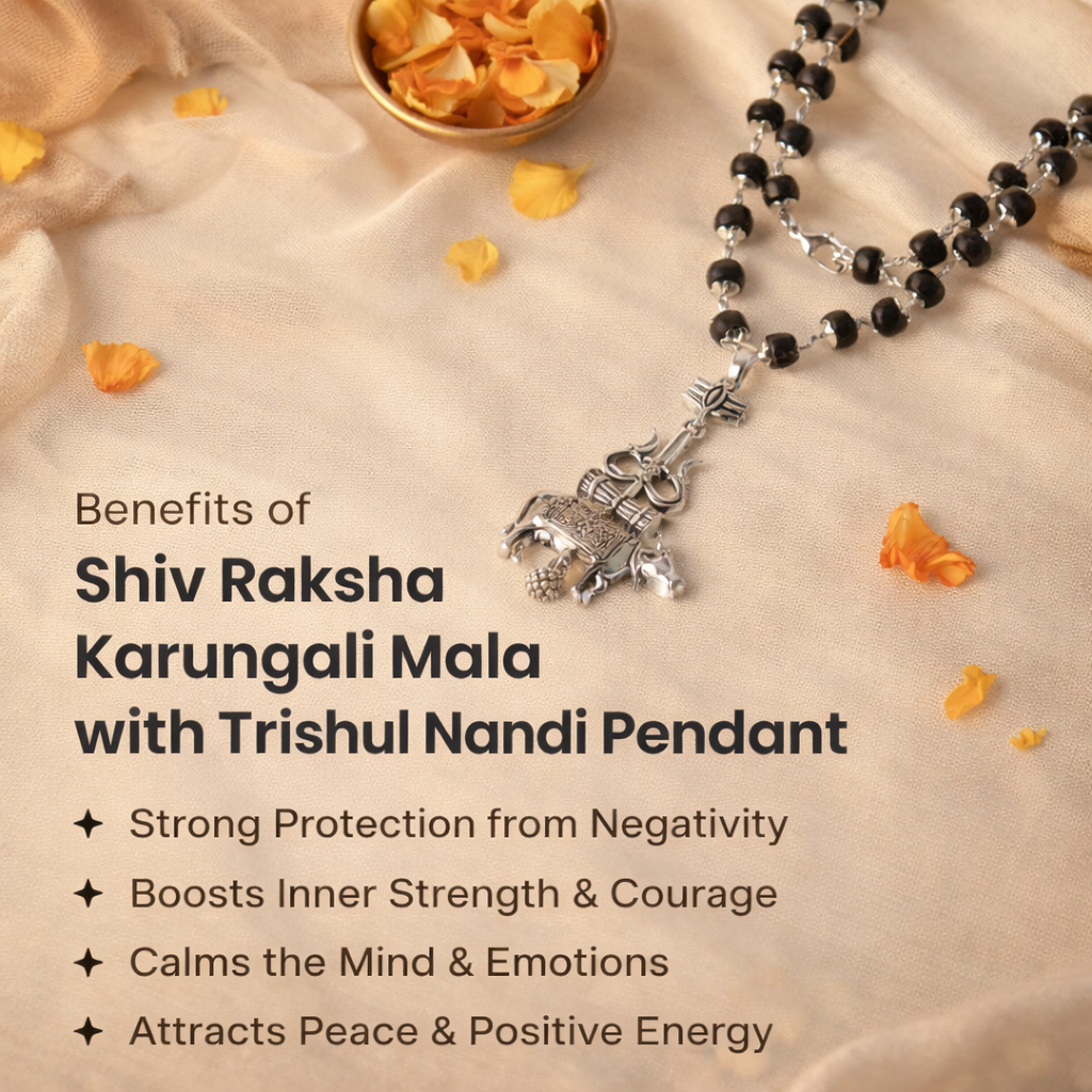 A sacred Shiv Raksha mala featuring 108 polished black Karungali (Ebony wood) beads. The mala is adorned with a detailed metallic pendant featuring Lord Shiva’s Trishul and Nandi the bull, symbolizing ultimate protection and devotion.