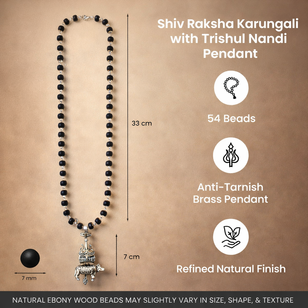 A sacred Shiv Raksha mala featuring 108 polished black Karungali (Ebony wood) beads. The mala is adorned with a detailed metallic pendant featuring Lord Shiva’s Trishul and Nandi the bull, symbolizing ultimate protection and devotion.