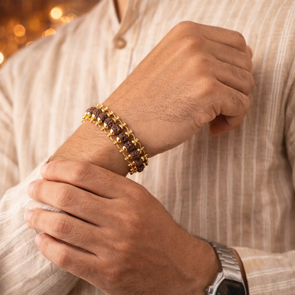 A premium Gold Plated Rudraksha bracelet featuring natural brown 5-faced (Panchmukhi) beads. Each bead is delicately encased in high-polish gold-plated caps and connected by a sturdy gold-toned chain, secured with a classic lobster claw clasp.