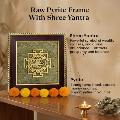 Raw Pyrite Frame with Shree Yantra on a wooden surface with decorative items.