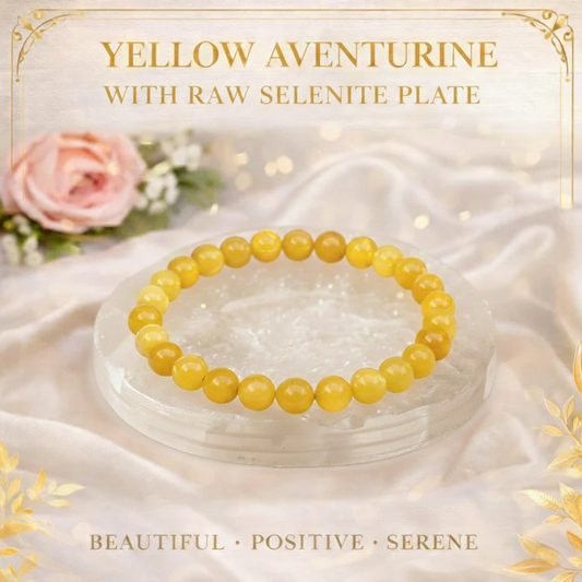 Natural Yellow Aventurine beaded bracelet resting on a raw white Selenite charging plate for energy boosting and cleansing.
