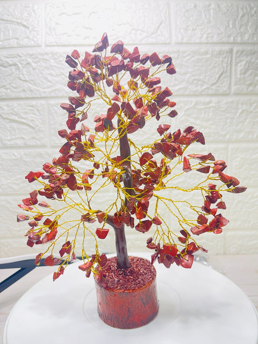 Handcrafted Red Jasper Crystal Tree with golden wire branches and natural red jasper chips on a wooden base for grounding, protection, and stability.