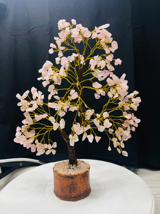 Handcrafted Rose Quartz Crystal Tree with golden wire branches and natural rose quartz chips on a wooden base for love, harmony, and emotional healing.