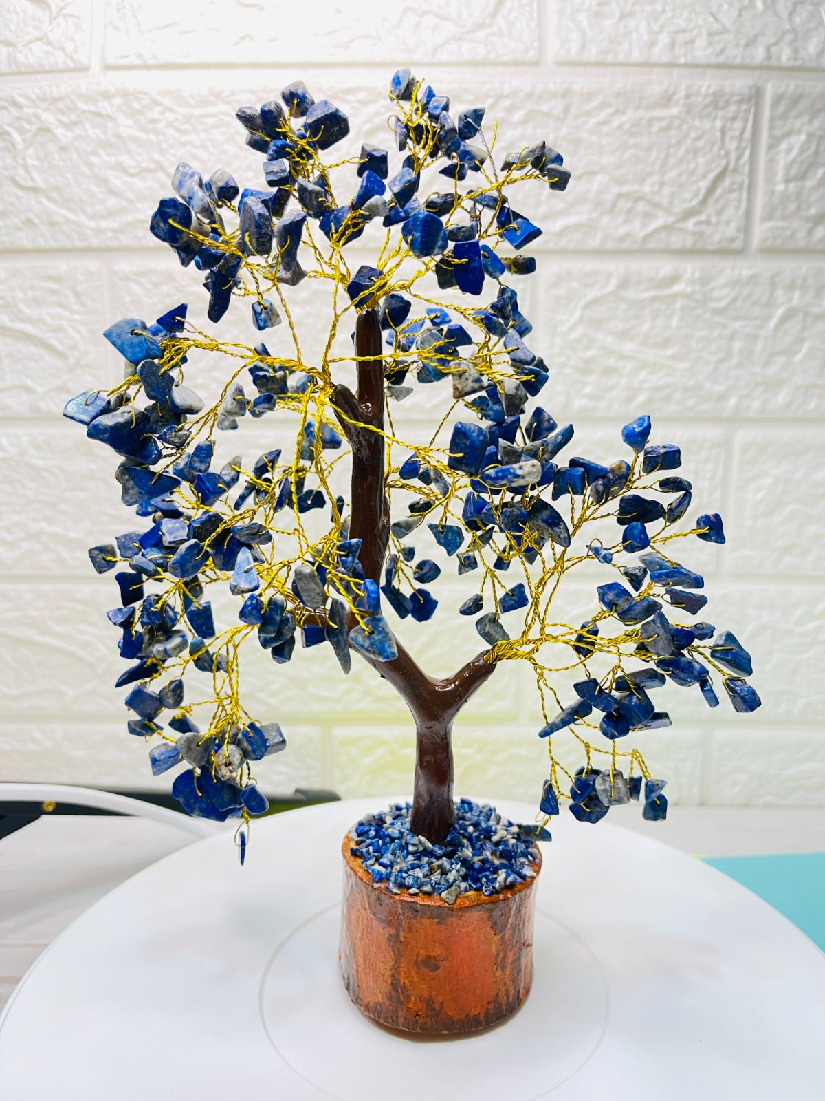 Handcrafted Lapis Lazuli Crystal Tree with golden wire branches and natural blue lapis chips on a wooden base for wisdom, clarity, and positive energy.