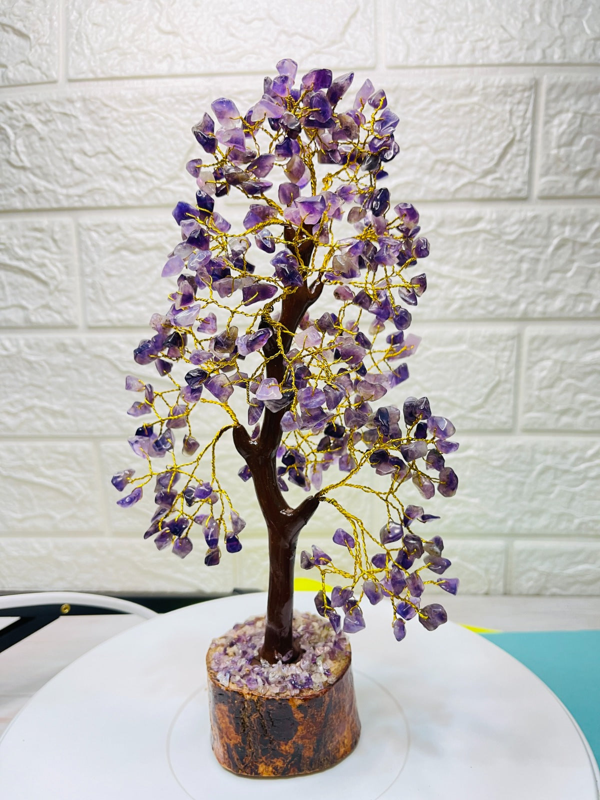 Handcrafted Amethyst Crystal Tree with golden wire branches and natural amethyst chips on a wooden base for positivity and healing energy.