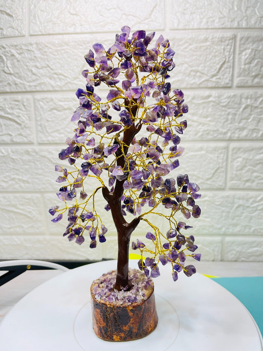 Handcrafted Amethyst Crystal Tree with golden wire branches and natural amethyst chips on a wooden base for positivity and healing energy.