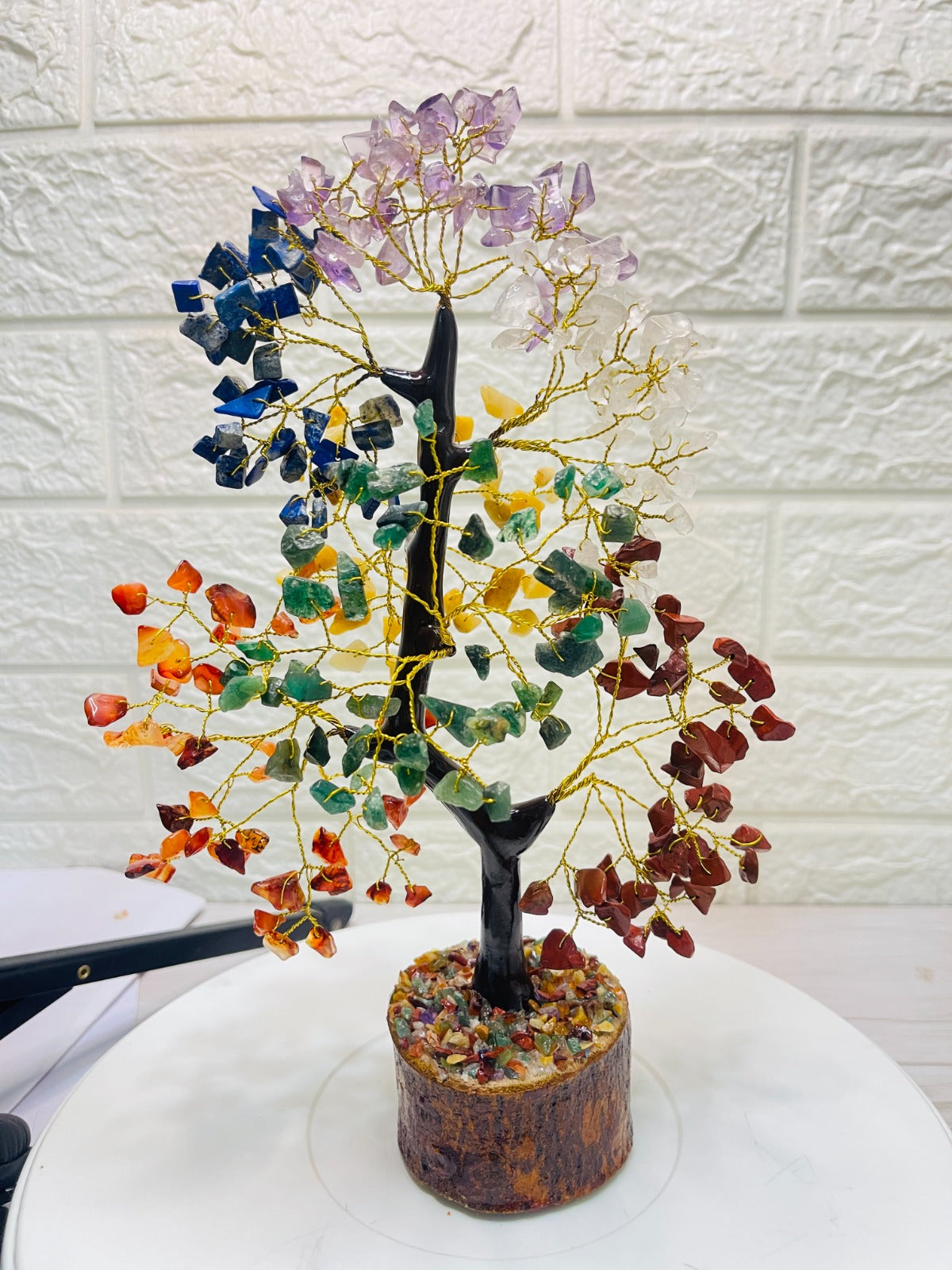 Handcrafted 7 Chakra Crystal Tree with golden wire branches and natural multicolor chakra stones on a wooden base for energy balancing, healing, and positive vibrations.