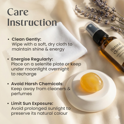 Polished Yellow Aventurine tumble stone on a white surface, known for confidence, motivation, and positive energy.