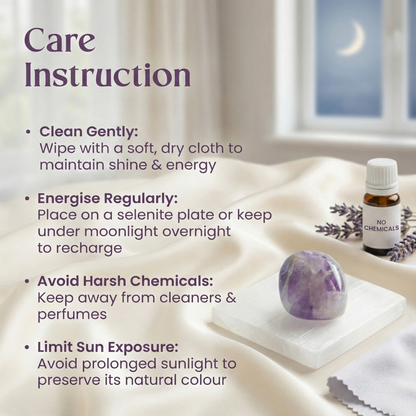 Polished Amethyst tumble stone placed on a white surface, known for calmness, intuition, and spiritual protection.